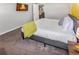 Bedroom with large bed, neutral colors, flatscreen television, and easy access to the en-suite bathroom at 951 S Fulton St, Aurora, CO 80247