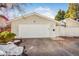 Detached one car garage with a white door and traditional siding at 951 S Fulton St, Aurora, CO 80247