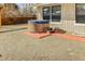 Outdoor hot tub with brick pathway, providing a relaxing retreat in the backyard at 951 S Fulton St, Aurora, CO 80247