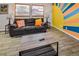 Comfortable living room featuring a leather sofa and modern furnishings at 951 S Fulton St, Aurora, CO 80247