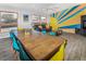 Open-concept living space with dining table, stylish decor, and natural light at 951 S Fulton St, Aurora, CO 80247