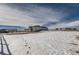 Aerial view of house and snowy backyard at 229 High Meadows Loop, Elizabeth, CO 80107