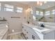 Modern bathroom with double vanity and large mirror at 229 High Meadows Loop, Elizabeth, CO 80107