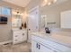 Main floor bathroom with white vanity and quartz countertop at 229 High Meadows Loop, Elizabeth, CO 80107