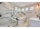 Luxurious bathroom with marble finishes and soaking tub at 229 High Meadows Loop, Elizabeth, CO 80107