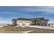 Ranch style home with three car garage and inviting front porch at 229 High Meadows Loop, Elizabeth, CO 80107