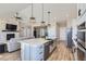 Open concept kitchen with large island and stainless steel appliances at 229 High Meadows Loop, Elizabeth, CO 80107