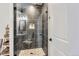 Modern shower with glass enclosure and pebble floor at 229 High Meadows Loop, Elizabeth, CO 80107