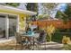 Outdoor patio with metal table and seating, perfect for al fresco dining at 3126 S Vine St, Englewood, CO 80113