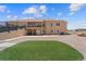 Expansive backyard featuring a deck, a patio, and a synthetic lawn area at 38087 E 147Th Pl, Keenesburg, CO 80643