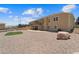 Large backyard with a deck, a patio, and low-maintenance gravel landscaping at 38087 E 147Th Pl, Keenesburg, CO 80643