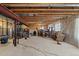 A view of the expansive unfinished basement with exposed ceiling beams and a structural beam at 38087 E 147Th Pl, Keenesburg, CO 80643