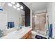 Bathroom with a shower and bright vanity at 38087 E 147Th Pl, Keenesburg, CO 80643