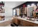 Bathroom featuring double sinks, a tub, and plenty of storage at 38087 E 147Th Pl, Keenesburg, CO 80643