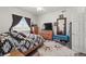 Bedroom with a large window, a cozy bed and wooden furniture at 38087 E 147Th Pl, Keenesburg, CO 80643