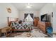 Bedroom featuring a comfy bed, wooden furniture, and a bright window at 38087 E 147Th Pl, Keenesburg, CO 80643
