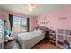 Bedroom with nice floors, a cozy bed and great window at 38087 E 147Th Pl, Keenesburg, CO 80643