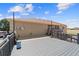 Spacious deck area with a view of the backyard and surrounding landscape at 38087 E 147Th Pl, Keenesburg, CO 80643