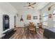 Cozy dining area featuring wood floors, a ceiling fan, and custom decor at 38087 E 147Th Pl, Keenesburg, CO 80643