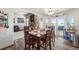 Spacious dining area features a wooden table, stylish decor, and a view of the outdoors at 38087 E 147Th Pl, Keenesburg, CO 80643