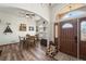 Charming entryway with hardwood floors, a dining area, and natural light at 38087 E 147Th Pl, Keenesburg, CO 80643