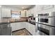 This well-equipped kitchen features stainless steel appliances and plenty of counter space at 38087 E 147Th Pl, Keenesburg, CO 80643