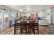 Open concept kitchen with eat in dining features butcher block countertops and stainless steel appliances at 38087 E 147Th Pl, Keenesburg, CO 80643