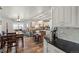 Well-lit kitchen boasts stainless appliances, ample cabinet space, and wood-look floors at 38087 E 147Th Pl, Keenesburg, CO 80643
