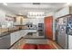 Well-lit kitchen offers an island, stainless steel appliances, and ample storage at 38087 E 147Th Pl, Keenesburg, CO 80643