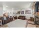 Spacious living room showcases neutral tones, comfortable furnishings and great fireplace at 38087 E 147Th Pl, Keenesburg, CO 80643