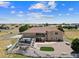 Beautifully landscaped backyard with a spacious patio, deck, and white fencing providing privacy at 38087 E 147Th Pl, Keenesburg, CO 80643