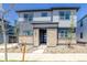Charming two-story home with stone accents and manicured front yard landscaping at 23951 E 40Th Ave, Aurora, CO 80019