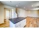 Open-concept kitchen and living area with hardwood floors and ample natural light at 23951 E 40Th Ave, Aurora, CO 80019