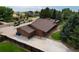 Brick ranch home with a large backyard and driveway at 14121 Countryhills Dr, Brighton, CO 80601