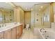 Primary bathroom with double vanity, large shower, and soaking tub at 14121 Countryhills Dr, Brighton, CO 80601