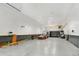 Large empty garage with high ceilings and ample space at 14121 Countryhills Dr, Brighton, CO 80601