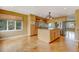 Spacious kitchen with island, wood cabinets, and stainless steel appliances at 14121 Countryhills Dr, Brighton, CO 80601