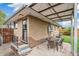 A cozy brick home with a covered backyard patio, perfect for outdoor entertaining and relaxation at 3620 Fairfax St, Denver, CO 80207