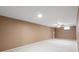 Spacious basement with neutral carpet and walls, with recessed lighting and ceiling fan at 3620 Fairfax St, Denver, CO 80207