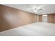Spacious basement with neutral carpet and walls, with recessed lighting and ceiling fan at 3620 Fairfax St, Denver, CO 80207