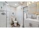Bathroom featuring glass enclosed shower, modern vanity with sink, and grey walls at 3620 Fairfax St, Denver, CO 80207