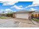 Detached garage with a concrete driveway offering ample parking space and additional storage at 3620 Fairfax St, Denver, CO 80207
