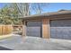 Close-up of garages with well-maintained doors and numbered units at 540 S Forest St # 8-101, Denver, CO 80246