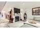 Comfortable living room showcasing a fireplace and neutral decor with hardwood floors and a modern design at 540 S Forest St # 8-101, Denver, CO 80246