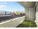 Charming balcony with artificial turf and potted plants, perfect for outdoor enjoyment at 14206 E 1St Dr # B10, Aurora, CO 80011