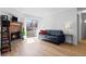 Bright living room featuring hardwood floors, fireplace, and sliding glass doors to the balcony at 14206 E 1St Dr # B10, Aurora, CO 80011