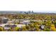 Stunning panoramic view of the cityscape surrounded by vibrant autumn foliage, highways, and modern apartment buildings at 2218 S Clayton St, Denver, CO 80210