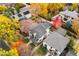 Stunning aerial view of a home surrounded by colorful fall foliage in a desirable neighborhood at 2218 S Clayton St, Denver, CO 80210