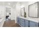 Stylish bathroom featuring double sinks and a large mirror at 2218 S Clayton St, Denver, CO 80210