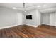 Bedroom with hardwood floors and a large window at 2218 S Clayton St, Denver, CO 80210